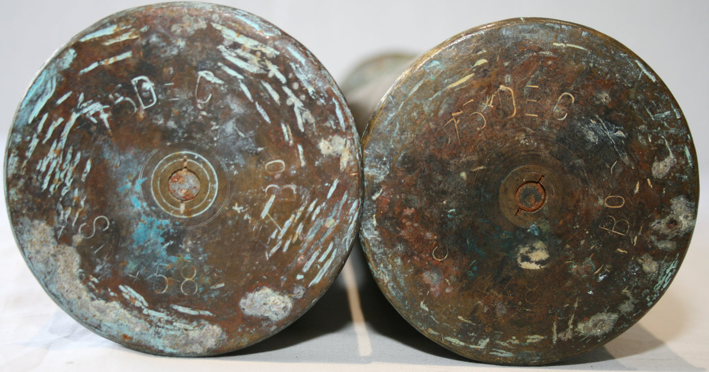 Pair of 75mm shell cases with 3 sided floral decoration.