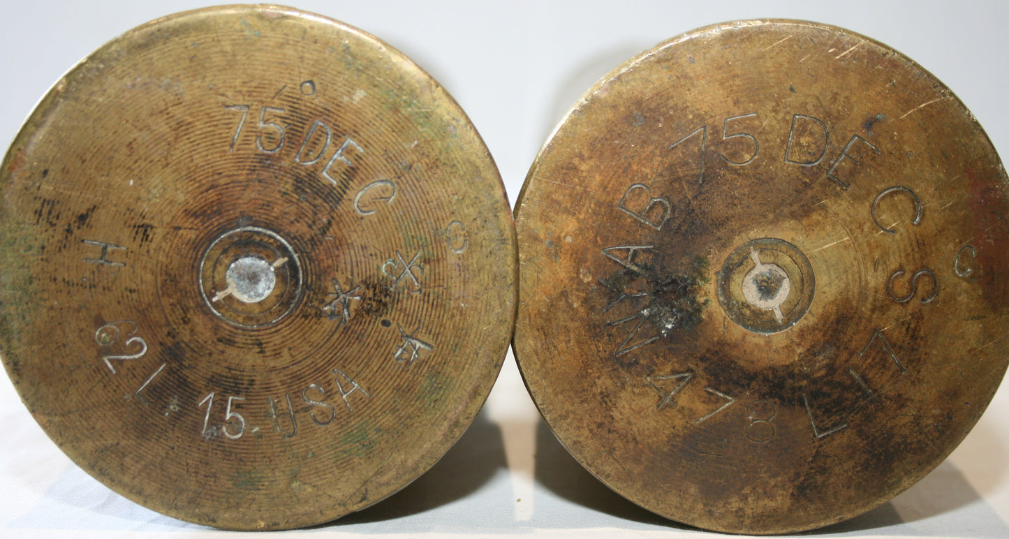 Pair of 75mm shell cases with floral decoration.