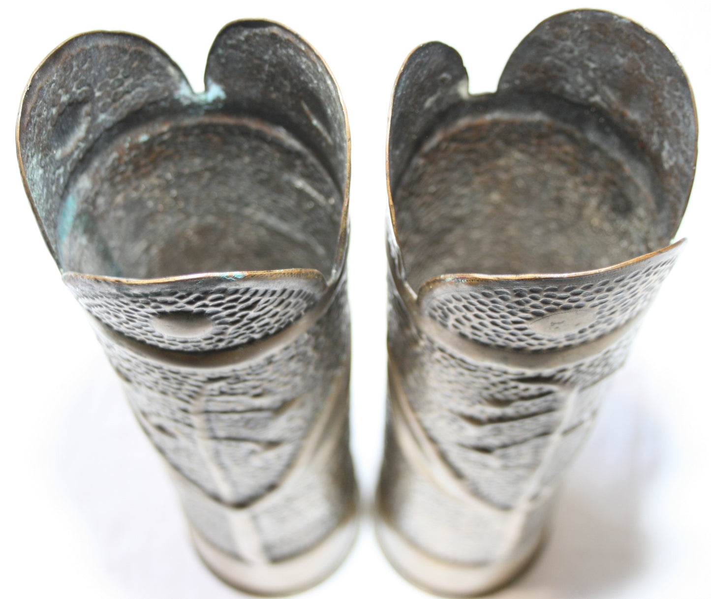 Pair of 75mm shell cases with floral decoration.