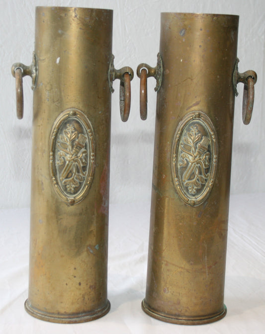 Pair of WWI 13 lb shells decorated with cartouche and handles