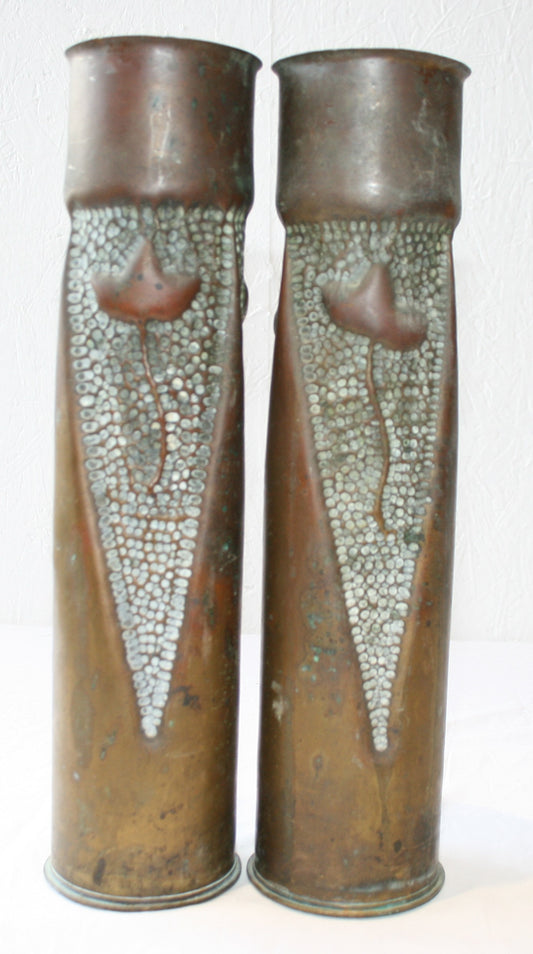 Pair of 75mm shell cases with 3 sided floral decoration.