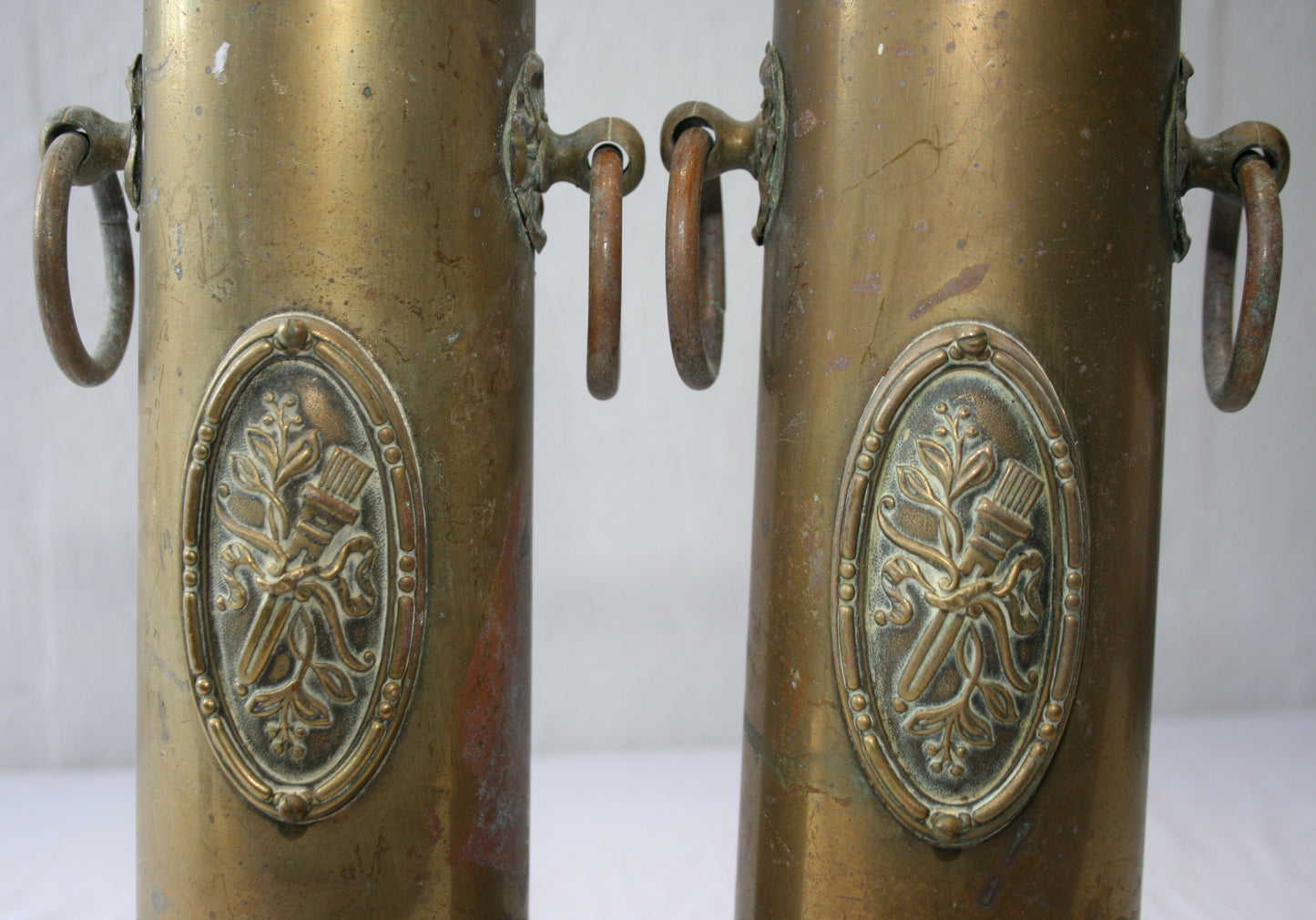 Pair of WWI 13 lb shells decorated with cartouche and handles