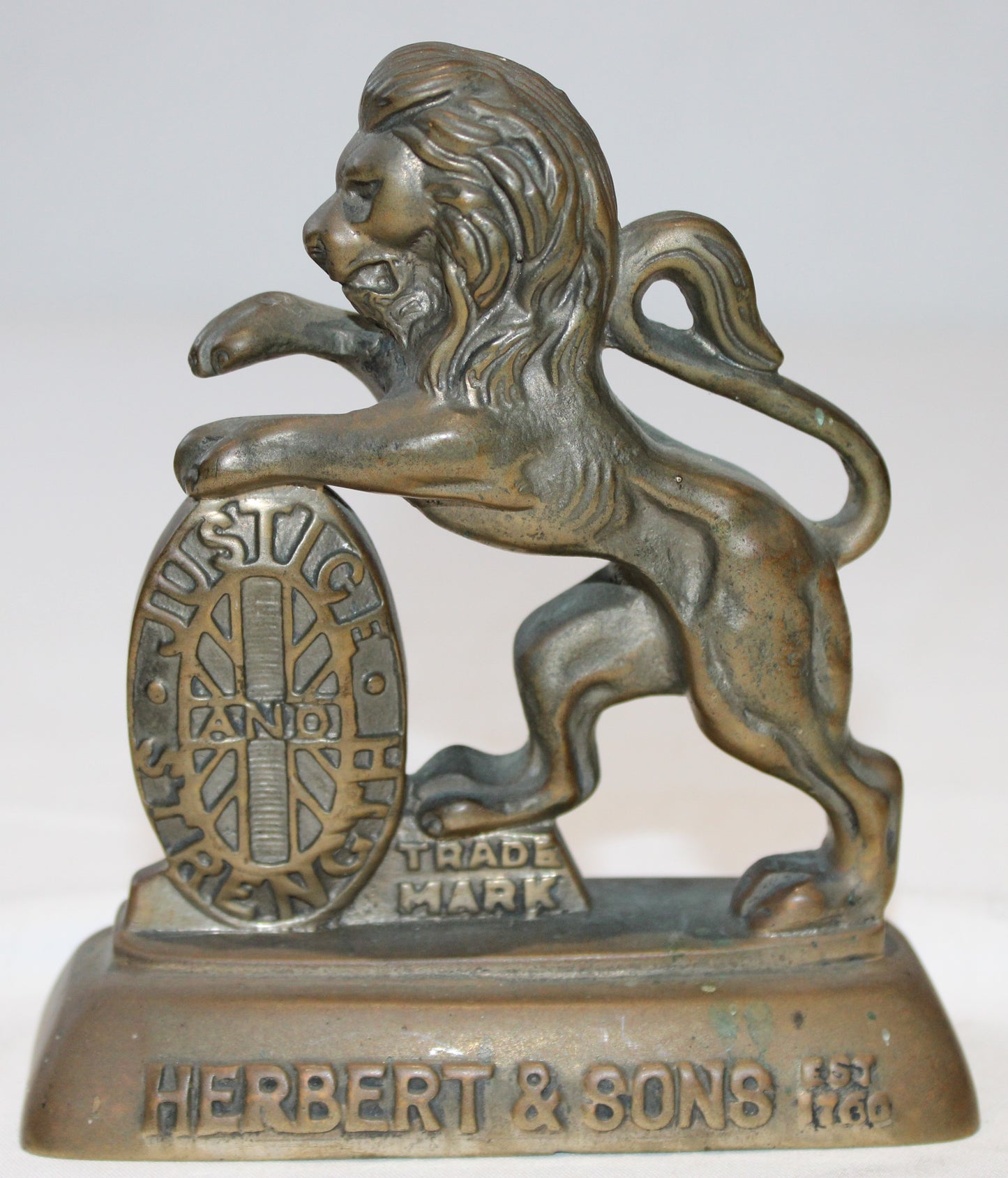 Antique brass Herbert & Sons lion trademark paperweight