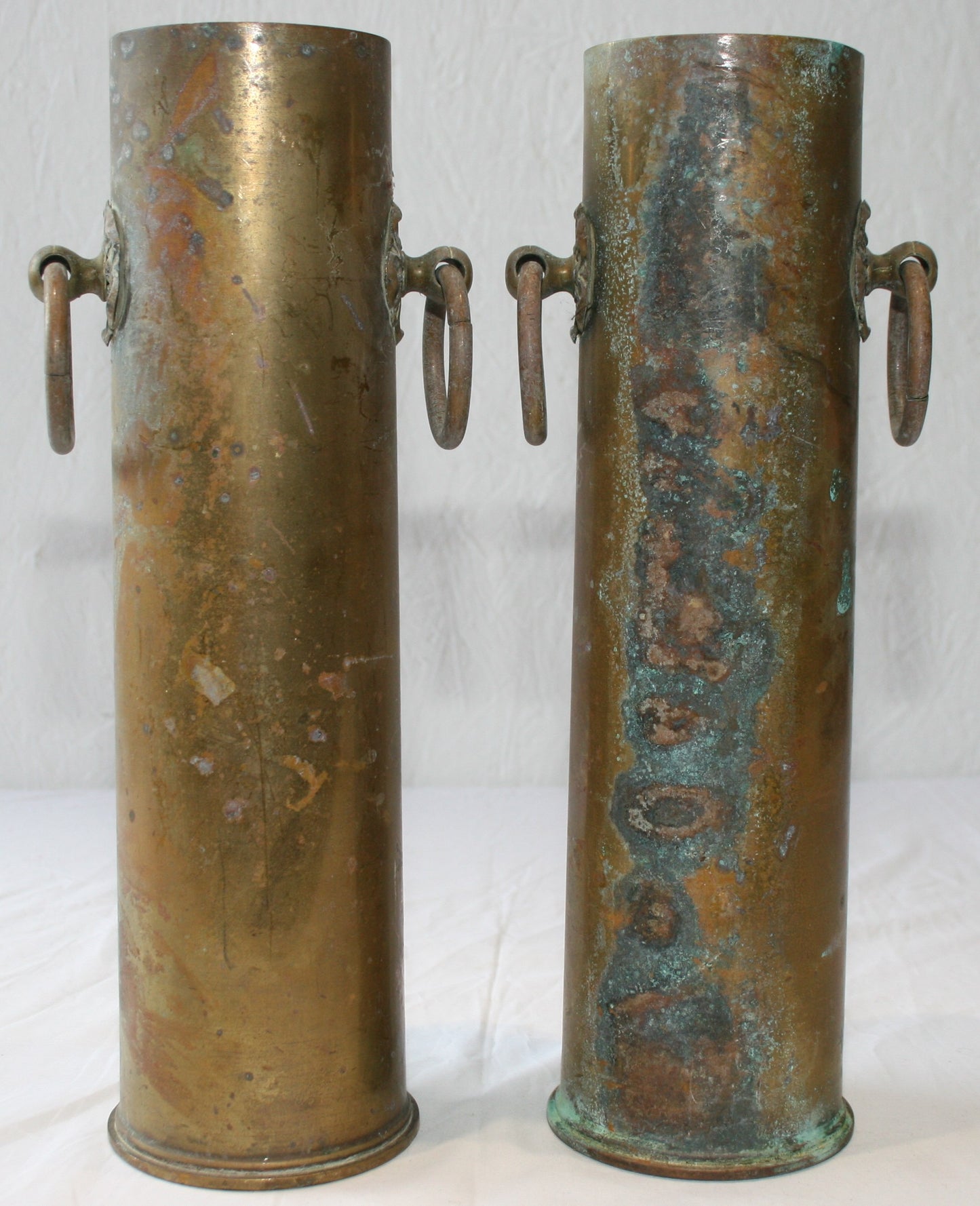 Pair of WWI 13 lb shells decorated with cartouche and handles
