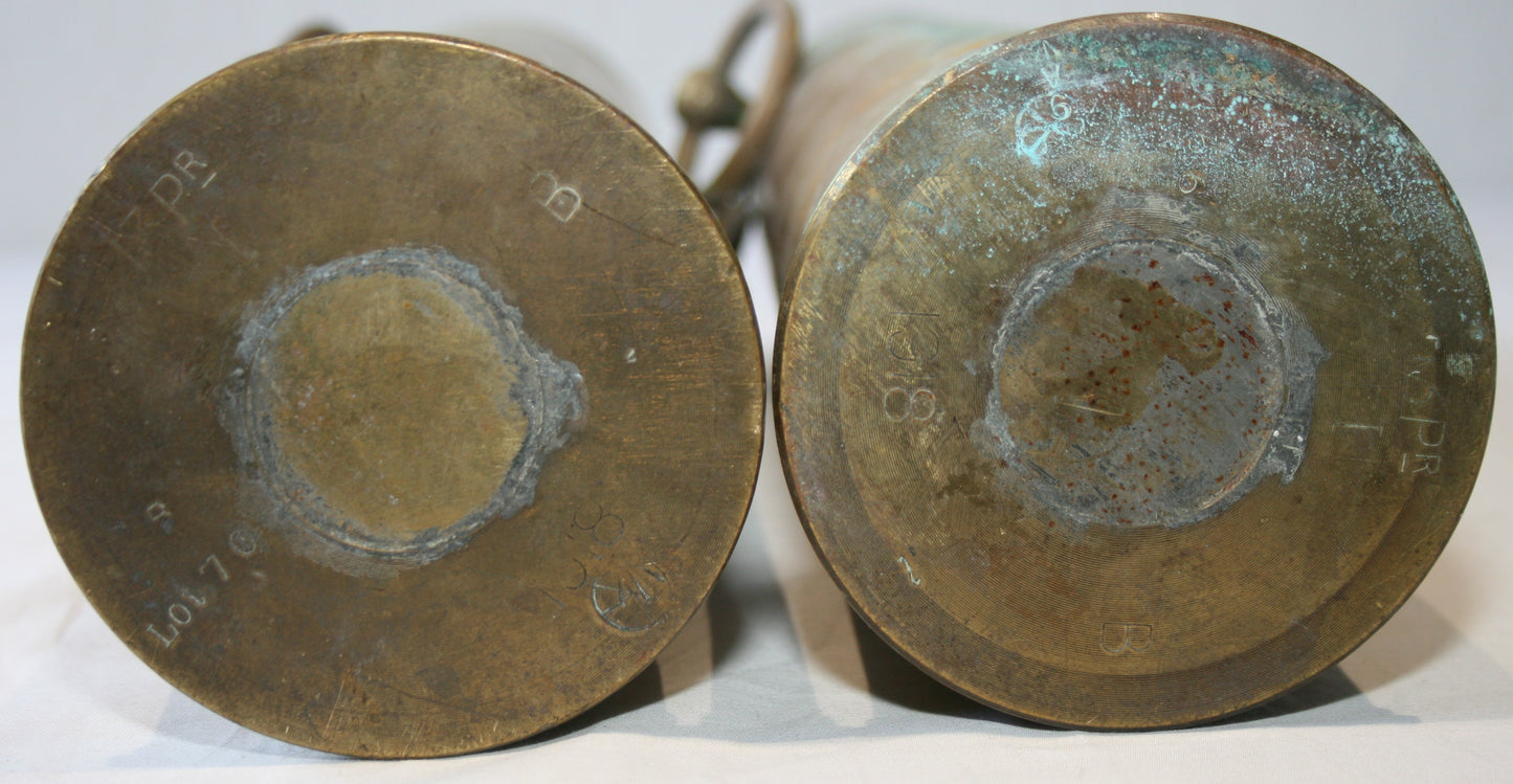 Pair of WWI 13 lb shells decorated with cartouche and handles