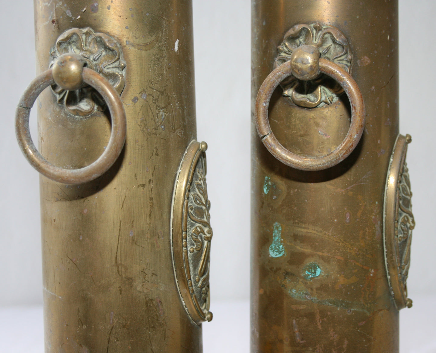 Pair of WWI 13 lb shells decorated with cartouche and handles
